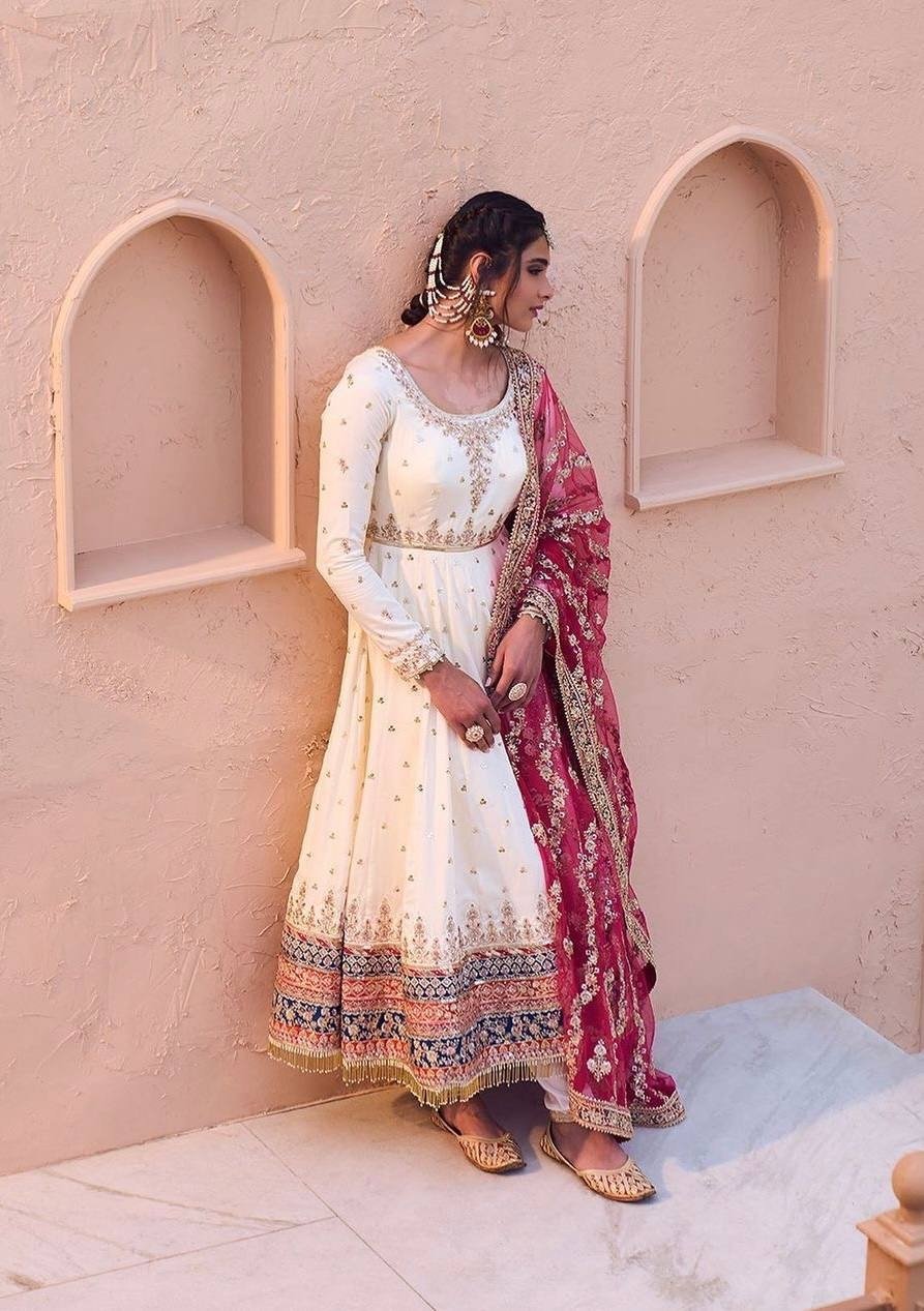 Ethereal Ivory Glow: Heavy Faux Georgette Anarkali Gown with Embroidered Tassels